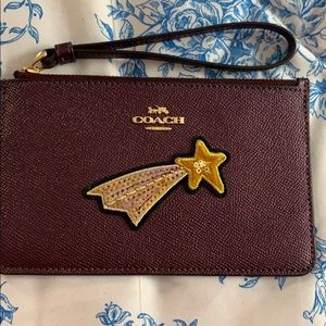 Deep purple Coach wristlet